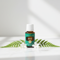 Mister Essential Oil on white marble with flowers