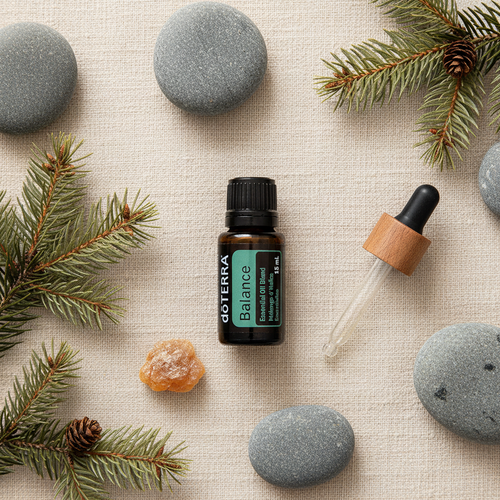 doTERRA Balance flatlay with smooth stones spruce sprigs and frankincense resin on cream linen