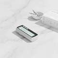 SM9128H Head Massager hero shot on white marble surface