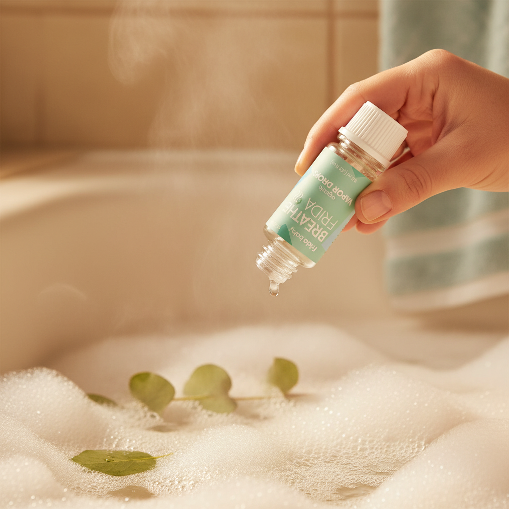 Parent adding Frida Baby Vapor Drops to baby bath