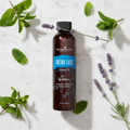 Ortho Ease Massage Oil marble flat lay with peppermint and lavender