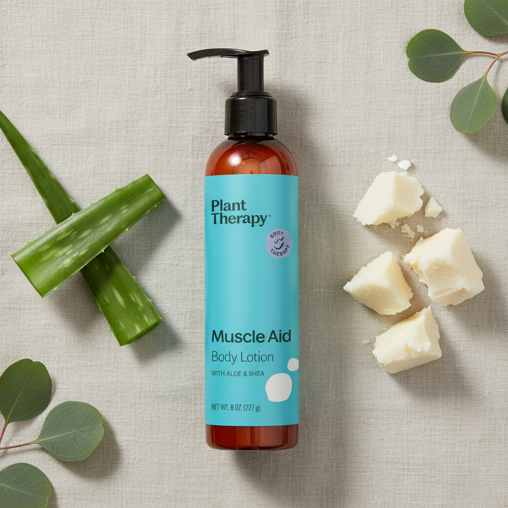 Plant Therapy Muscle Aid Body Lotion flat lay with aloe and shea